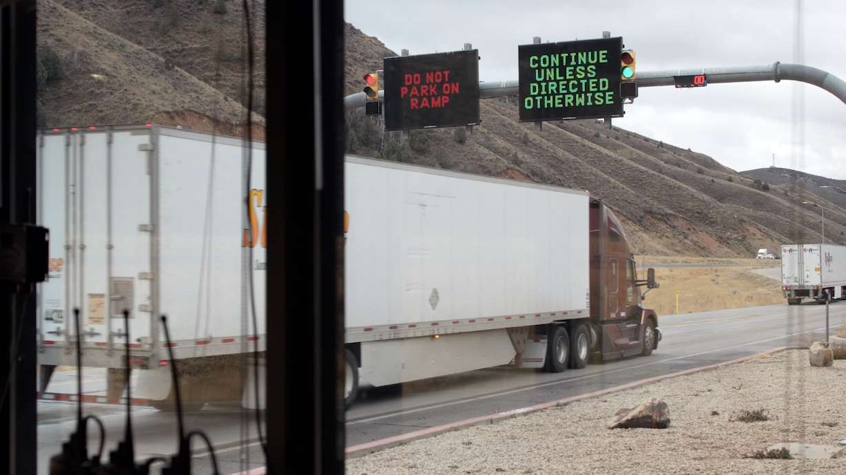 A semitruck rolls past an in-road tire anomaly detector at the Utah Department of Transportation's Echo Port of Entry in Summit County on Nov. 25. Officials said the new system has helped better identify flat tires in semitrucks and other freight vehicles.