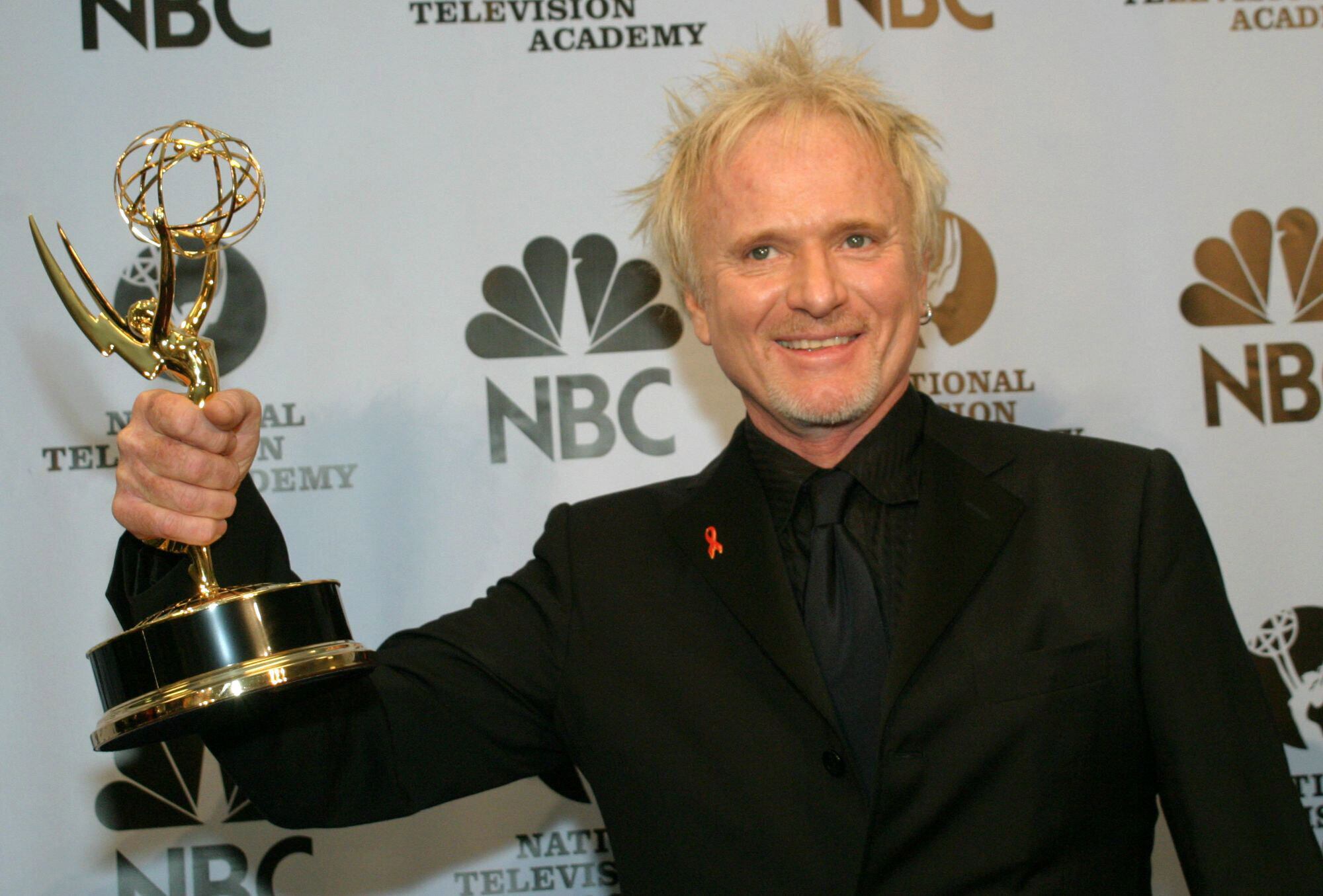 Anthony Geary holds up his Emmy as poses for photographers after winning outstanding lead actor in a drama series at the 31st Annual Daytime Emmy Awards in New York, May 21, 2004. Geary, who died Tuesday at the age of 78, won eight Daytime Emmys for his portrayal of Luke Spencer on "General Hospital."