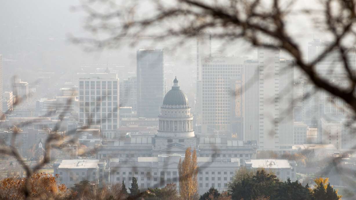 Smog is seen behind the Capitol during an inversion in Salt Lake City on Nov. 23. The region's latest inversion could clear on Wednesday, as wind and valley rain and mountain snow return to Utah.
