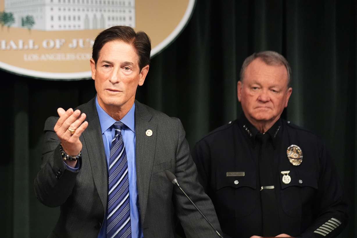 Los Angeles District Attorney Nathan Hochman, left, and LAPD Chief Jim McDonnell announce developments about the murder case of Rob Reiner and his wife Michele, Tuesday, in Los Angeles. Prosecutors announced they would charge Nick Reiner with two counts of first-degree murder in the killing of his parents.