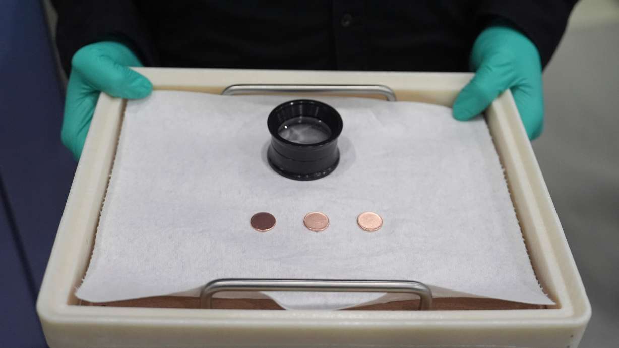 Blank coins wait to be the last pennies pressed at the U.S. Mint, in Philadelphia, Nov. 12. The Mint sold 232 three-cent sets for a sum of $16.76 million at an auction last Thursday.