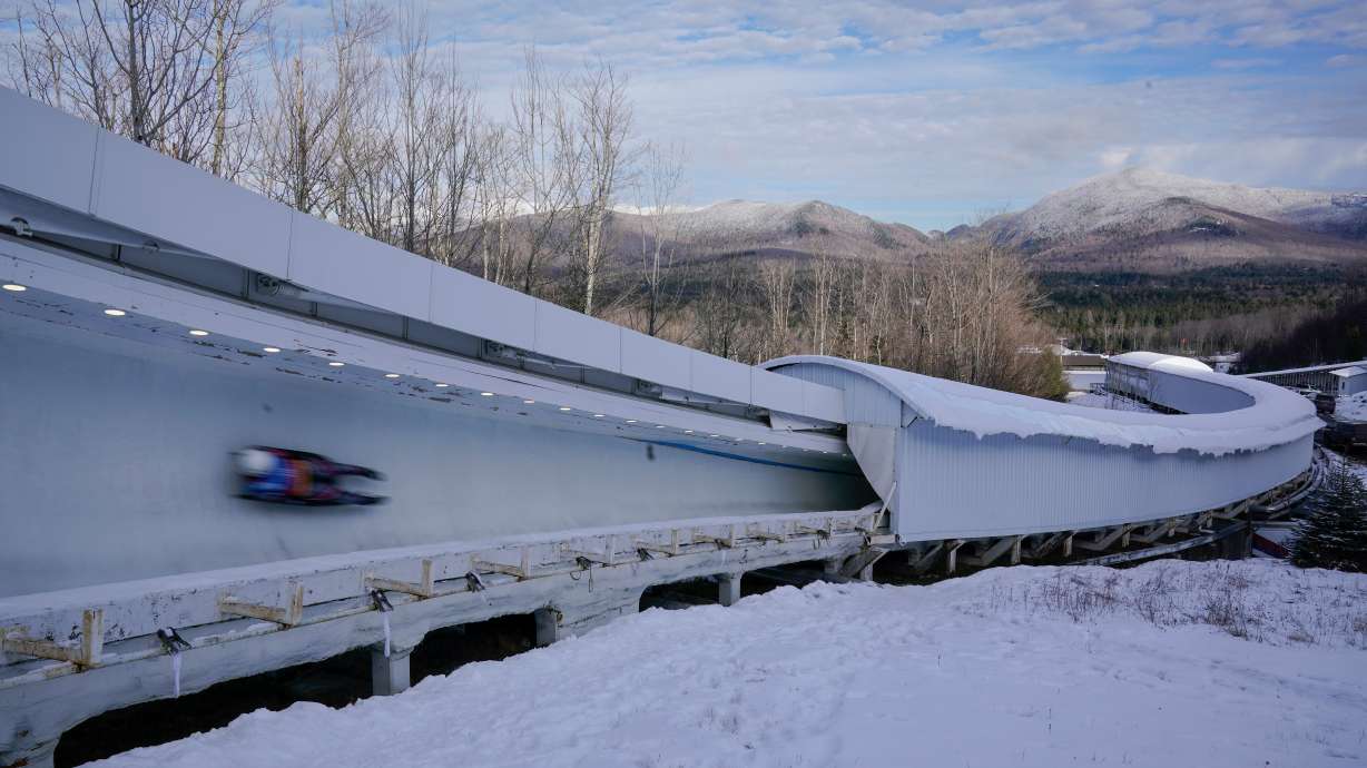 FILE - A luger slides down the track during the World Cup luge event in Lake Placid, N.Y., Dec. 8, 2023.