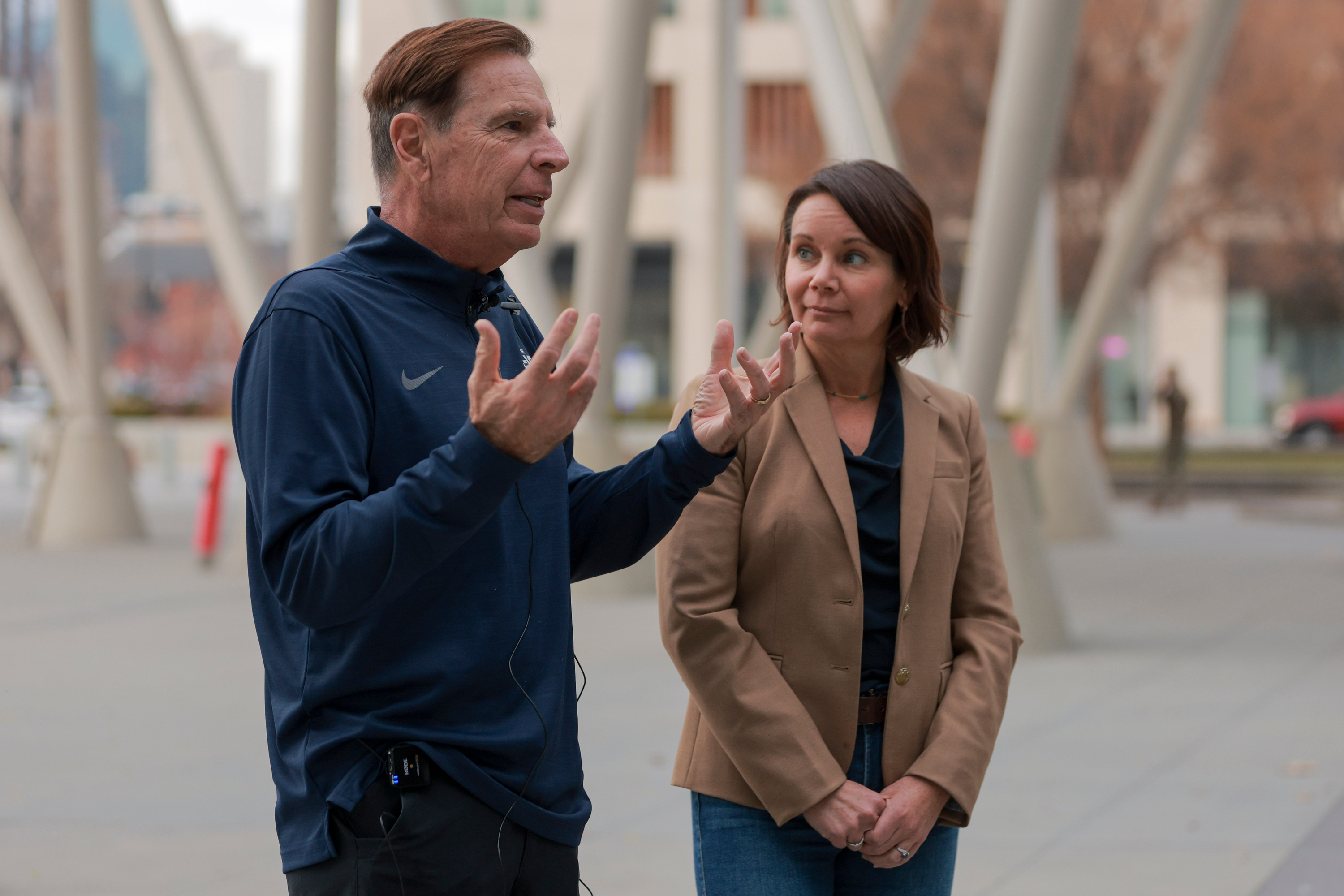 Fraser Bullock, executive chairman and president for the Salt Lake City-Utah Committee for the Games, left, and Rachel Otto, chief of staff for the Salt Lake City Mayor's Office, right, speak with media outside of the Salt Lake City Public Safety Building after a listening tour meeting in Salt Lake City on Tuesday.