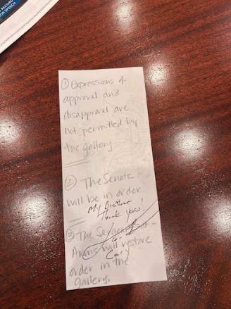 After Sen. Cory Booker broke the record for longest Senate speech in history, Sen. John Curtis had him sign a note outlining the Senate rules prohibiting expressions of approval — a rule Curtis waived to allow for a standing ovation.