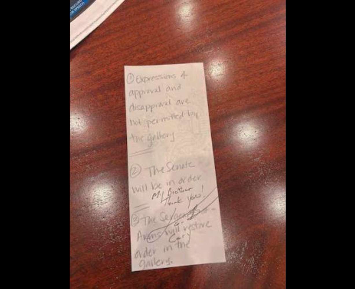 After Sen. Cory Booker broke the record for longest Senate speech in history, Sen. John Curtis had him sign a note outlining the Senate rules prohibiting expressions of approval — a rule Curtis waived to allow for a standing ovation.