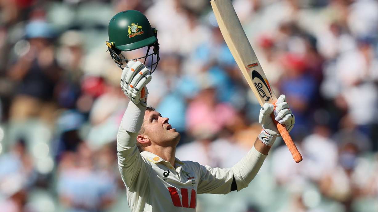 Australia's Alex Carey celebrates his century during play on day one of the third Ashes cricket test between England and Australia at the Adelaide Oval in Adelaide, Australia, Wednesday, Dec. 17, 2025.
