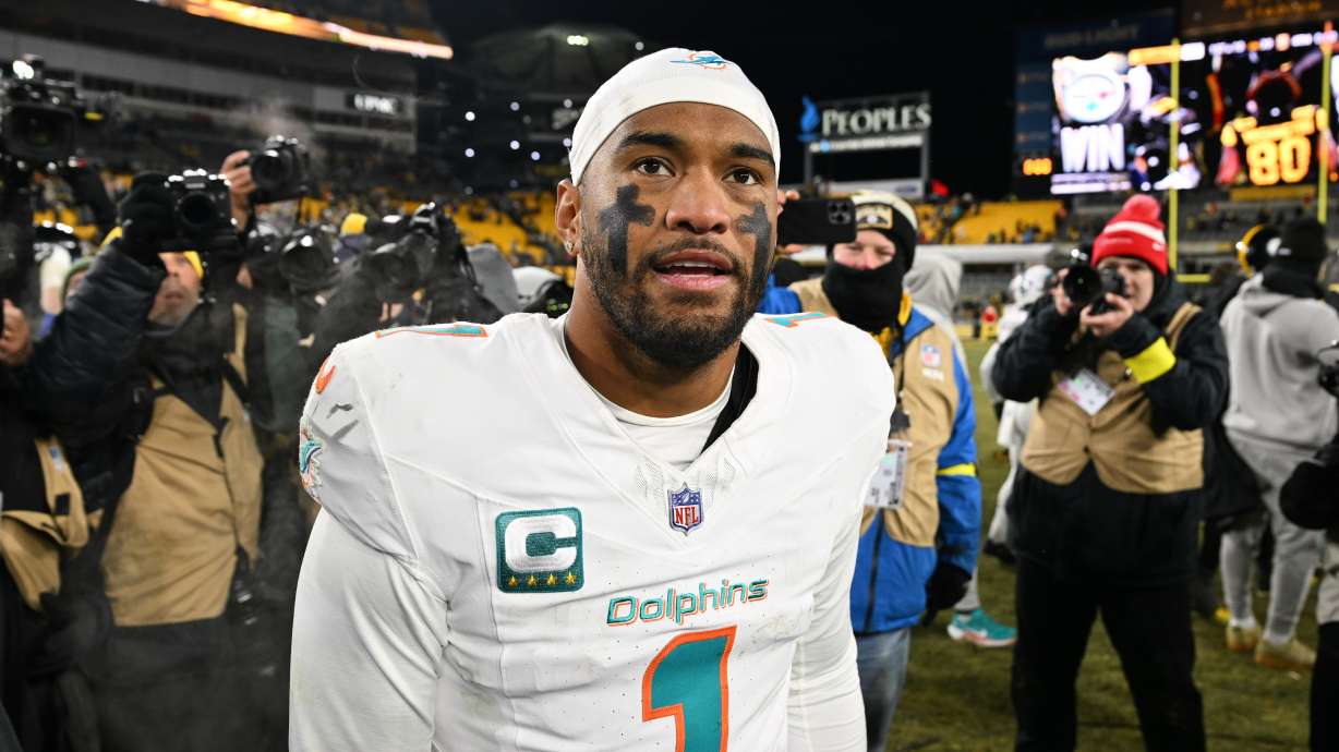 Miami Dolphins quarterback Tua Tagovailoa (1) walks off the field after an NFL football game against the Pittsburgh Steelers in Pittsburgh, Monday, Dec. 15, 2025.