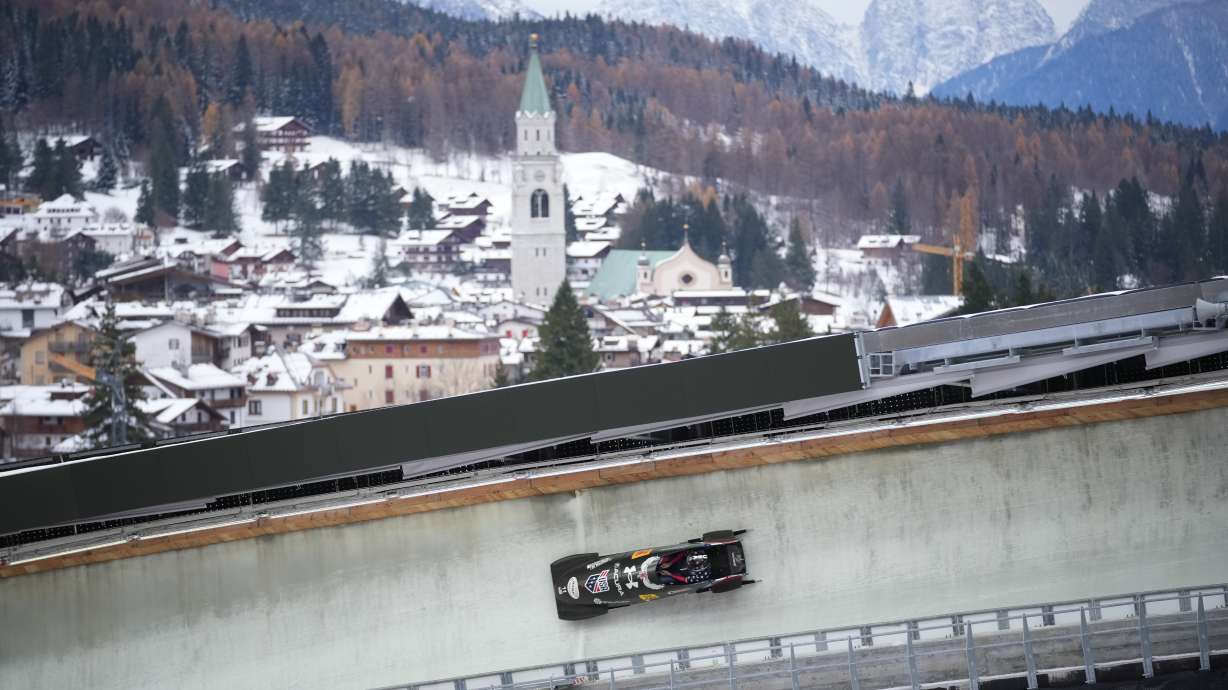 Kaillie Armbruster Humphries of the United States speeds down the course during a women's monobob World Cup race and Olympic test event in Cortina d'Ampezzo, Italy, Saturday, Nov. 22, 2025.