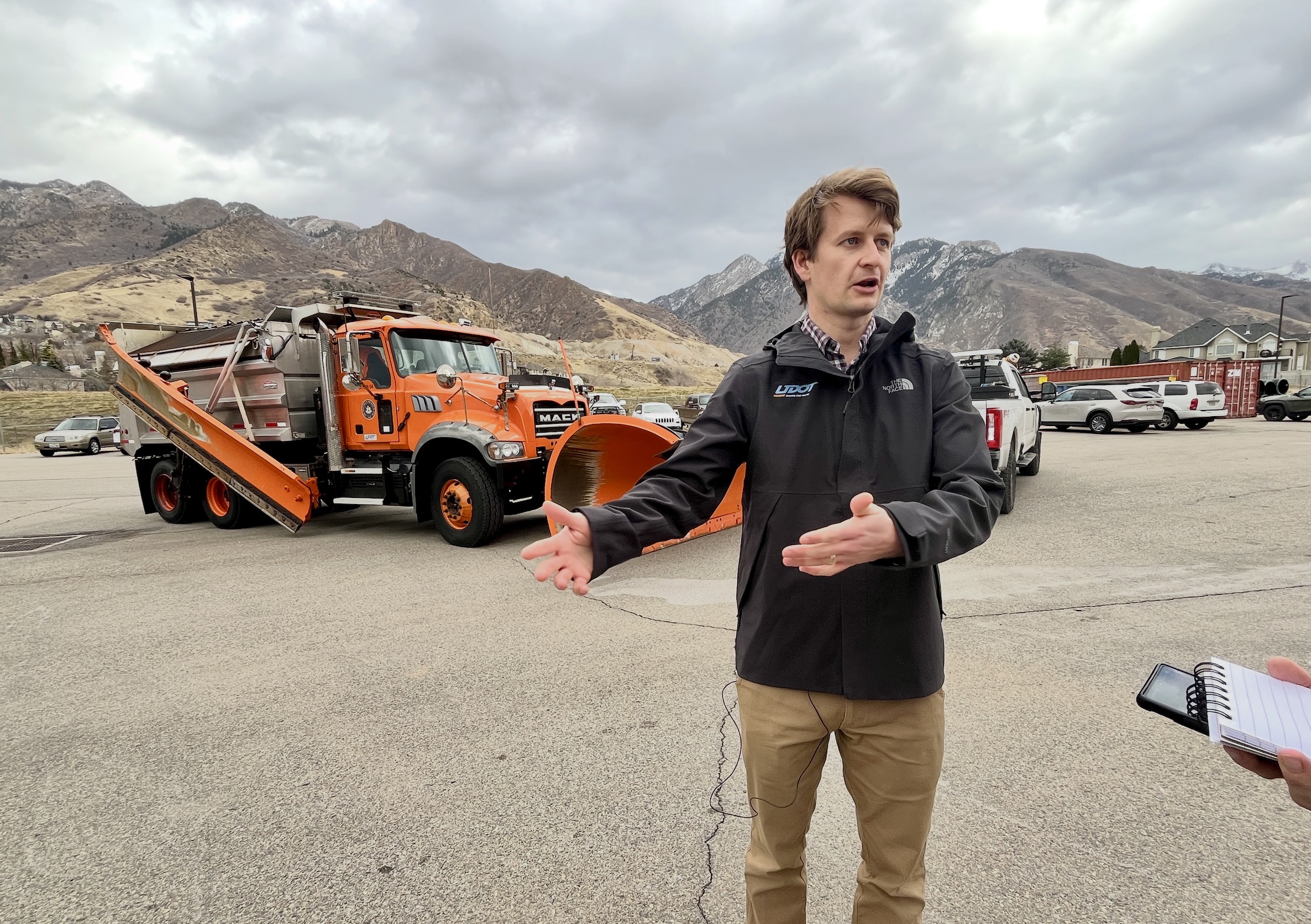 Devin Weder, a project manager for the Utah Department of Transportation, speaks to reporters at a UDOT maintenance facility in Cottonwood Heights on Wednesday.