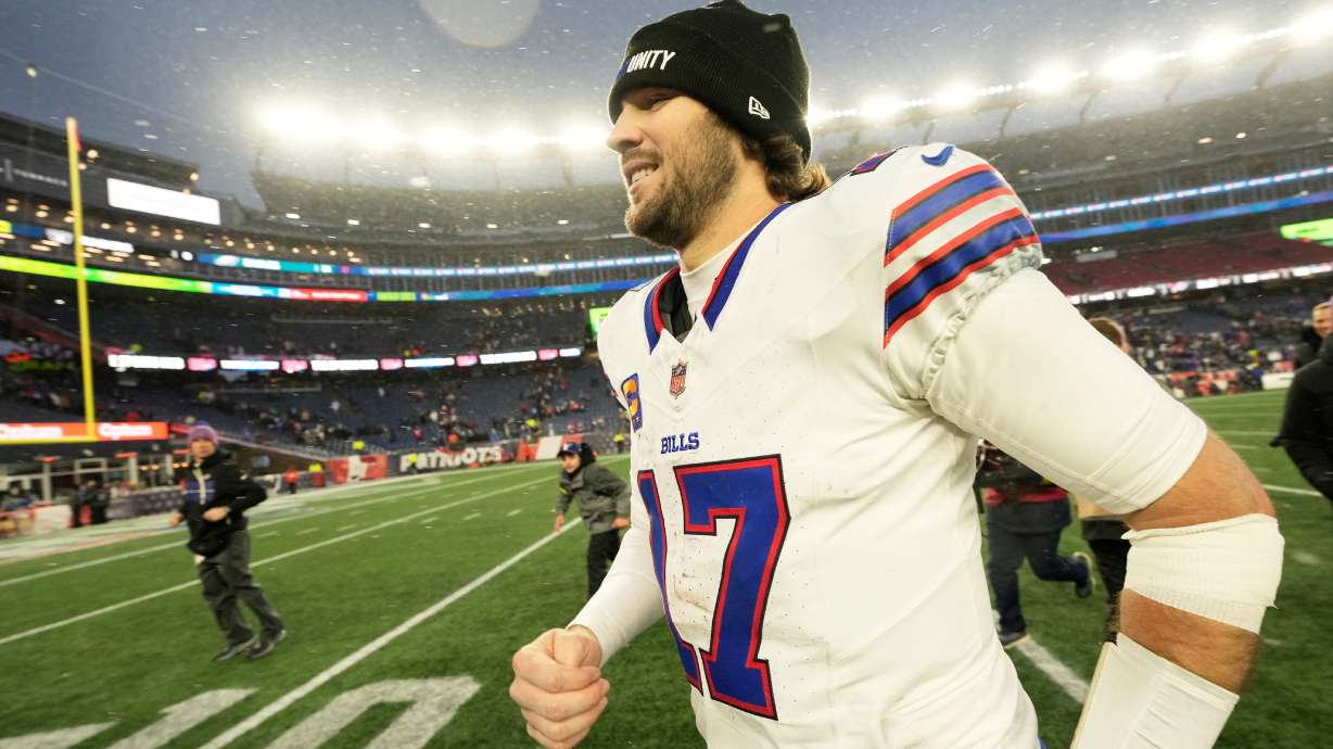Buffalo Bills quarterback Josh Allen jogs off the field after an NFL football game against the New England Patriots in Foxborough, Mass., Sunday, Dec. 14, 2025.
