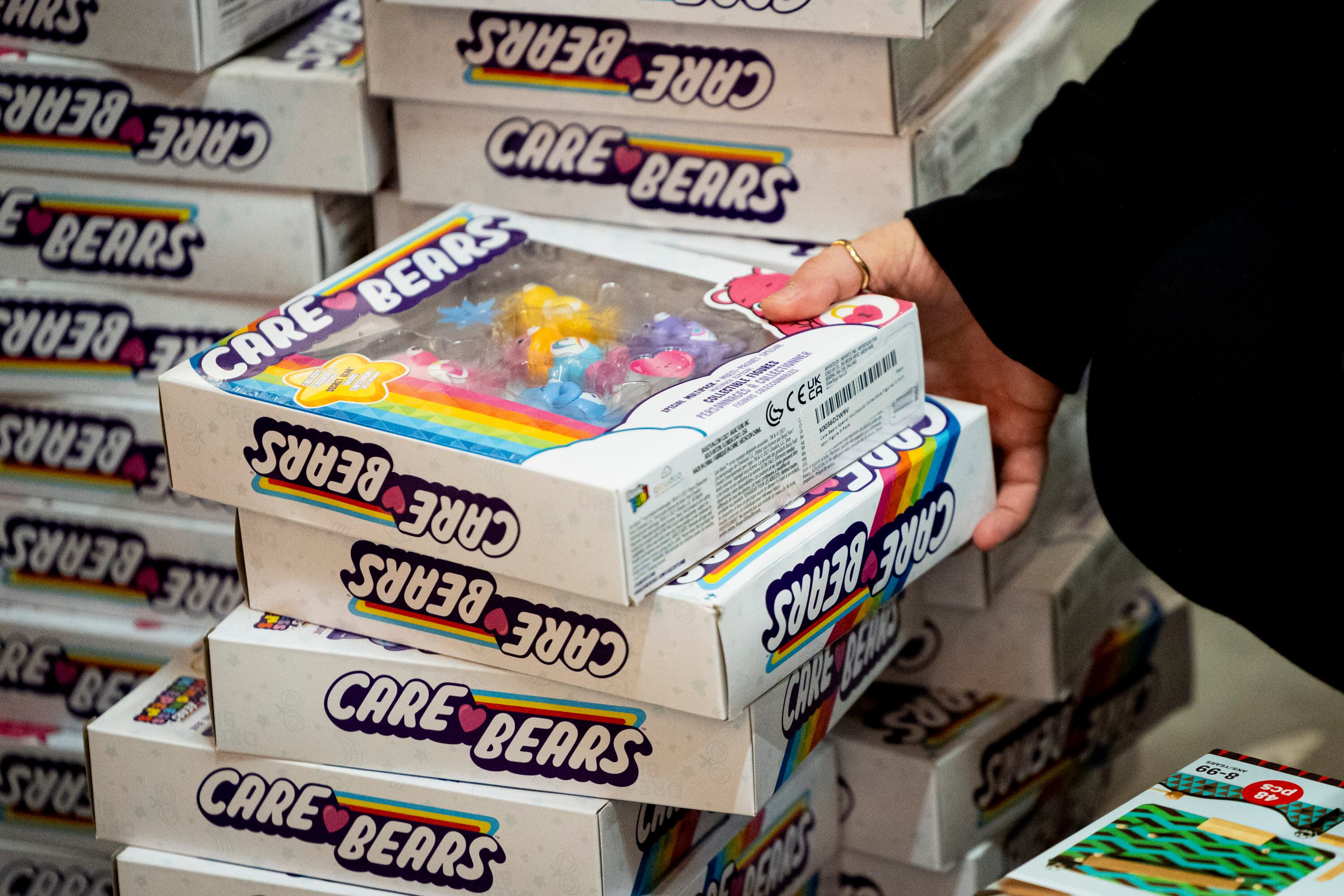 A person takes a few toys during a toy drive at the headquarters of We Are The They in Lehi on Wednesday.