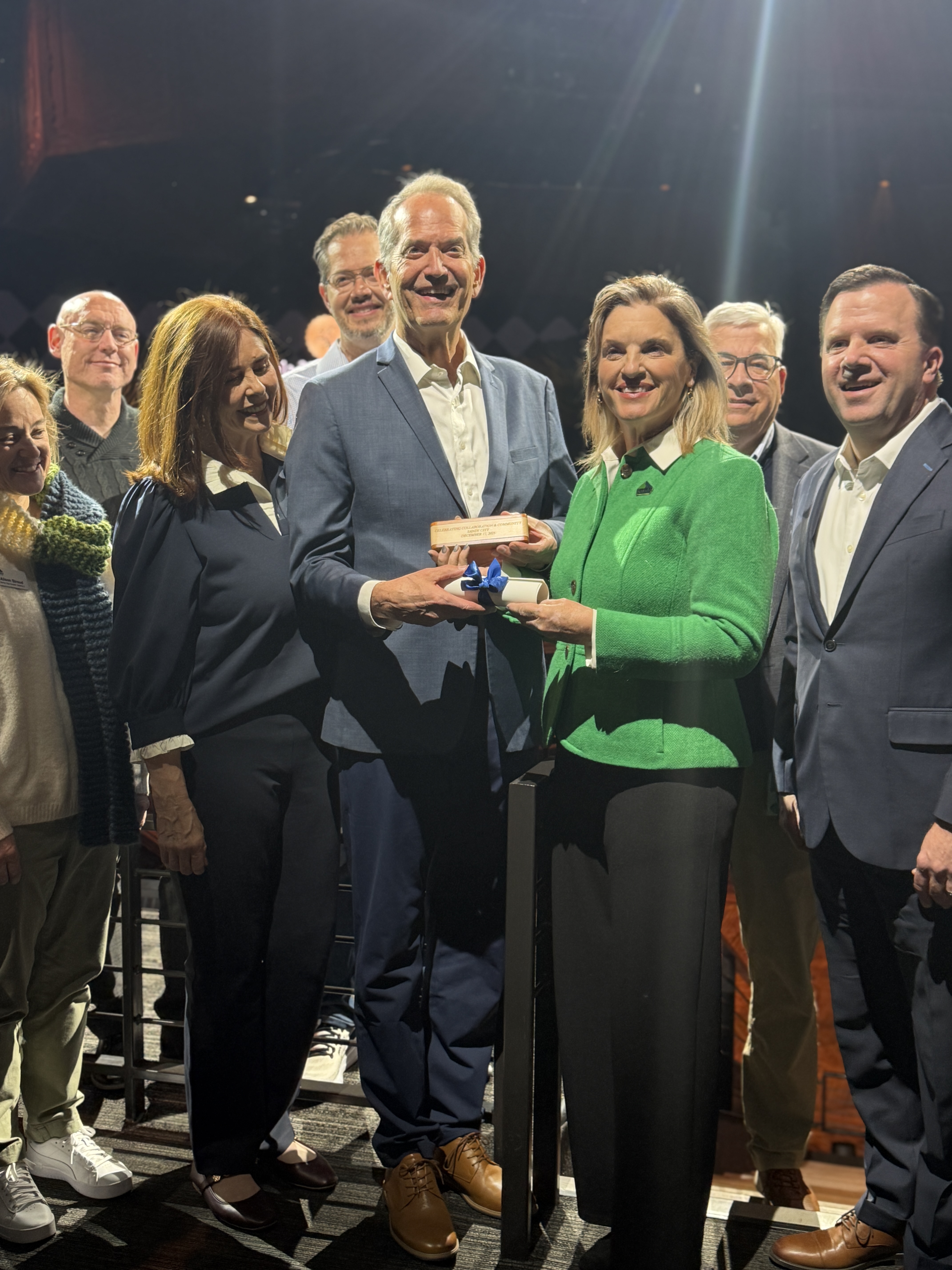 Leaders and representatives from the city of Sandy, Hale Centre Theatre and Mountain America Credit Union pose for a photo during a "transfer of the deed" celebration on Wednesday, Dec. 17, 2025.