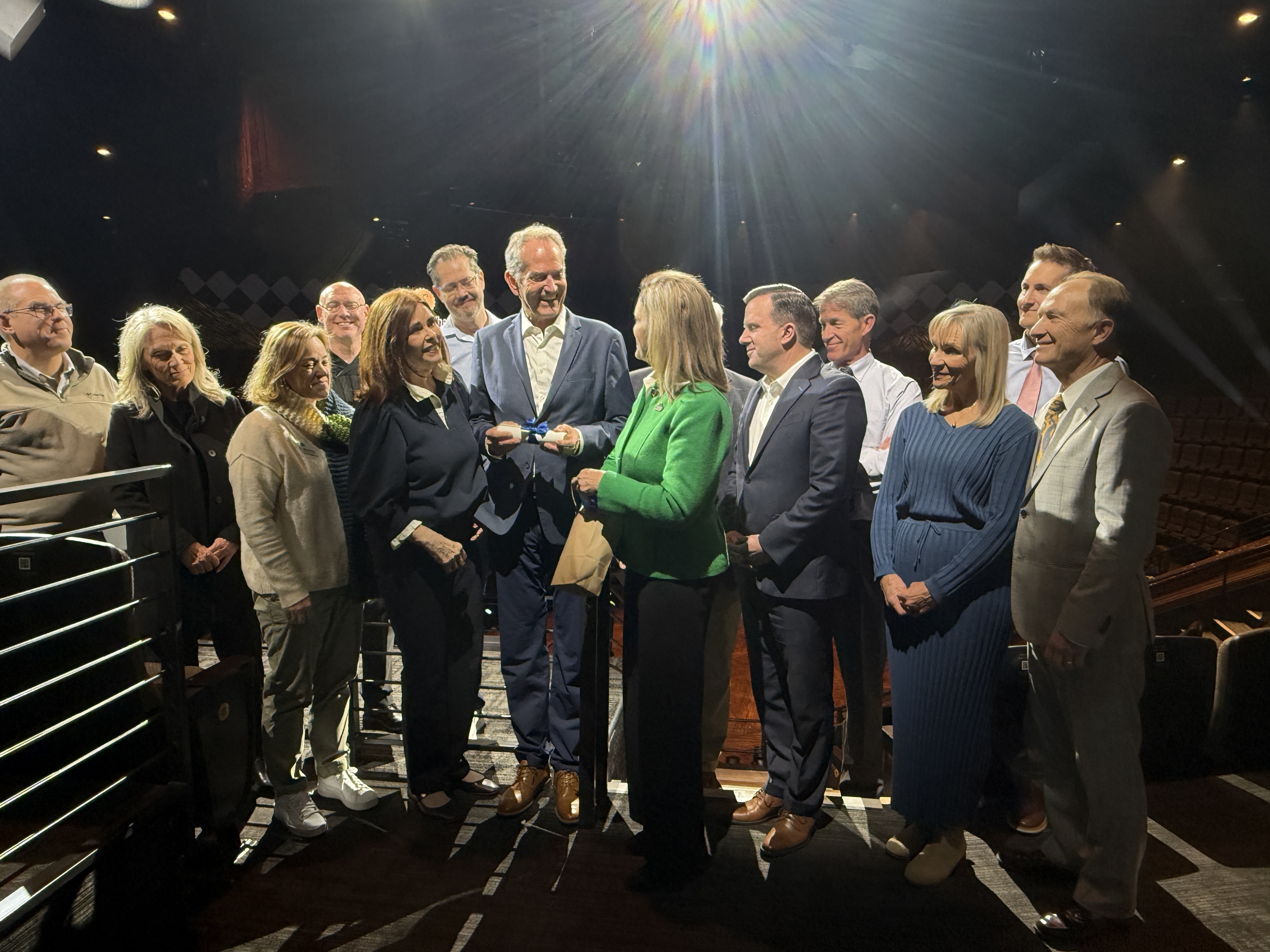 Leaders and representatives from the city of Sandy, Hale Centre Theatre and Mountain America Credit Union pose for a photo during a "transfer of the deed" celebration on Wednesday.