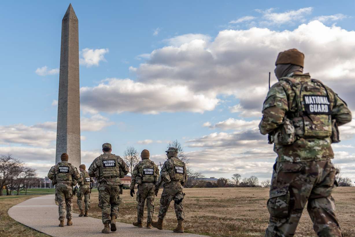 National Guardsmen patrol in front of the Washington Monument, Nov. 28, in Washington. Sen. Chris Coons, D-Del., criticized the deployment of guardsmen to patrol Washington.