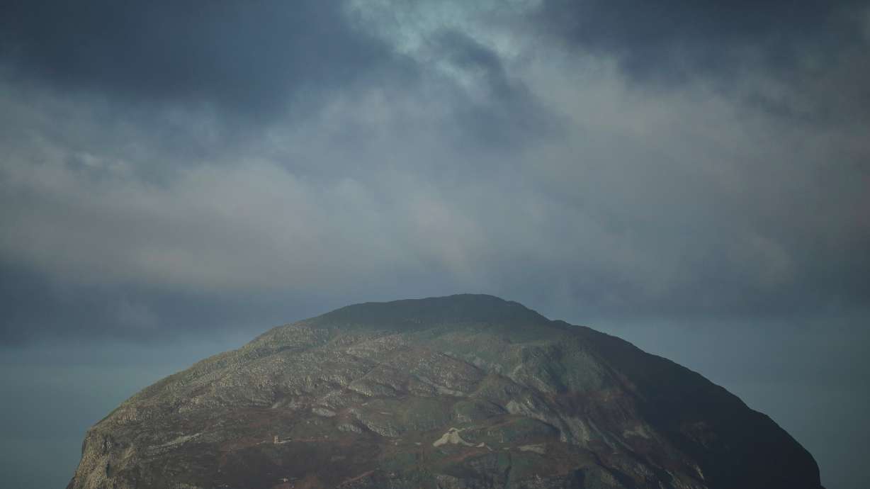 The island of Ailsa Craig, where the two types of granite, Common Green and Blue Hone, that are used to make curling stones is quarried from, is seen from the beach at Girvan, Scotland, Thursday, Nov. 13, 2025.