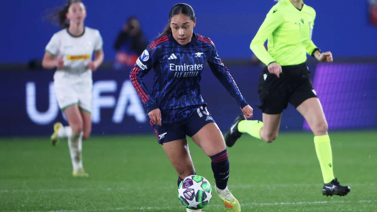 Arsenal's Olivia Smith runs with the ball during the women's Champions League opening phase soccer match between OH Leuven and Arsenal, in Leuven, Belgium, Wednesday, Dec. 17, 2025.