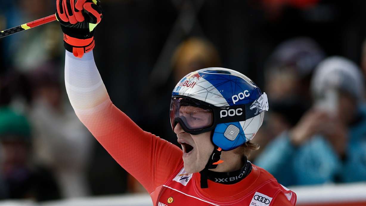 Switzerland's Marco Odermatt celebrates at the finish area of an alpine ski, men's World Cup downhill, in Val Gardena, Italy, Thursday, Dec. 18, 2025.