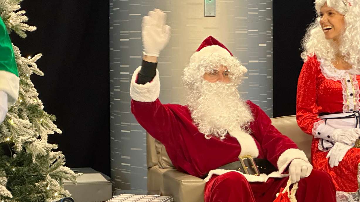 New York Mets pitcher Clay Holmes and wife Ashlyn, play Santa and Mrs. Claus during the baseball team’s holiday party, Thursday, Dec. 18, 2025, in New York.