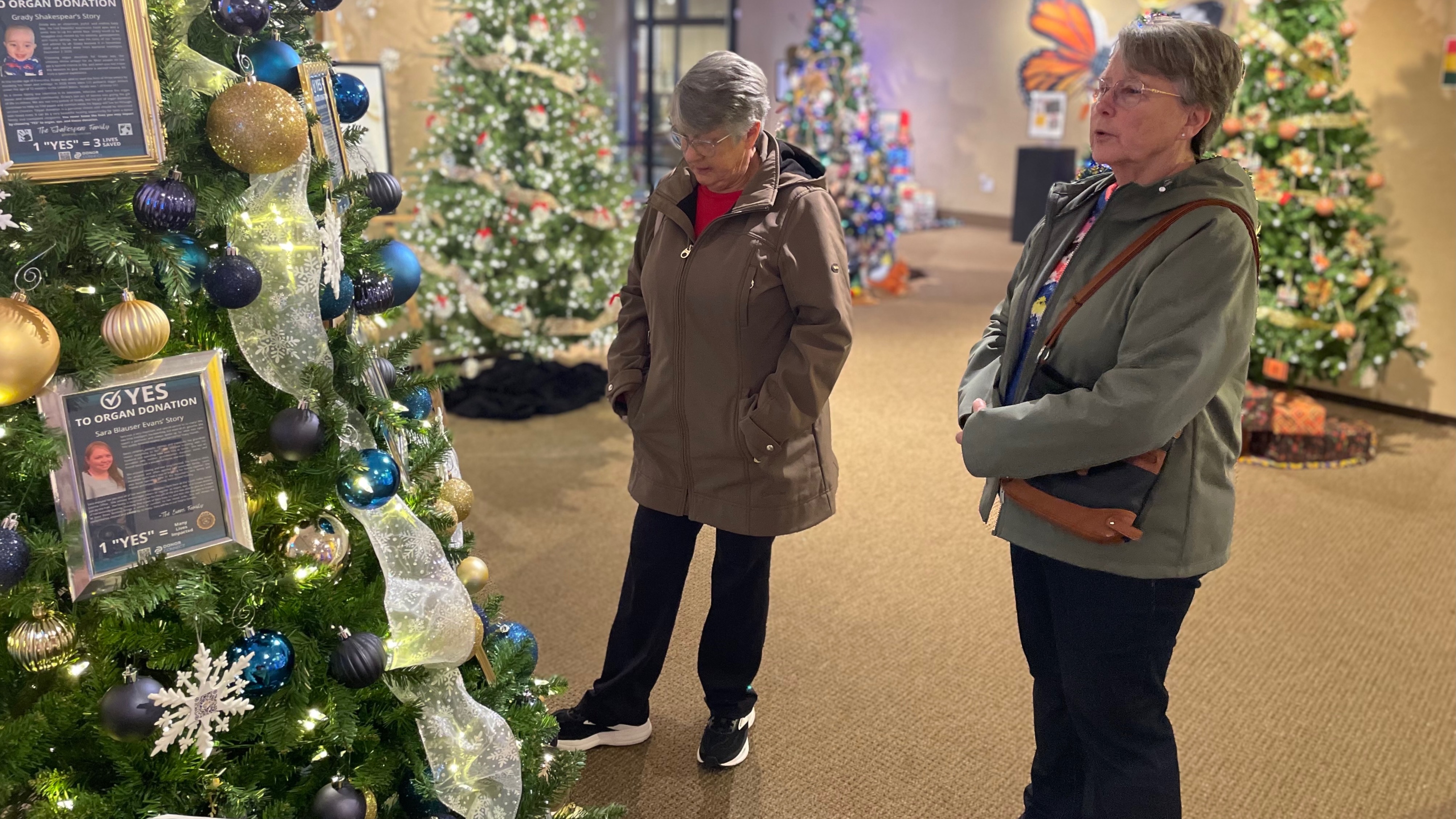 Susan Okerlund, left, and Sarah Rice visit the Trees of Diversity exhibit at the Utah Cultural Celebration Center in West Valley City on Thursday. The holiday exhibit showcases the community's varied cultures.