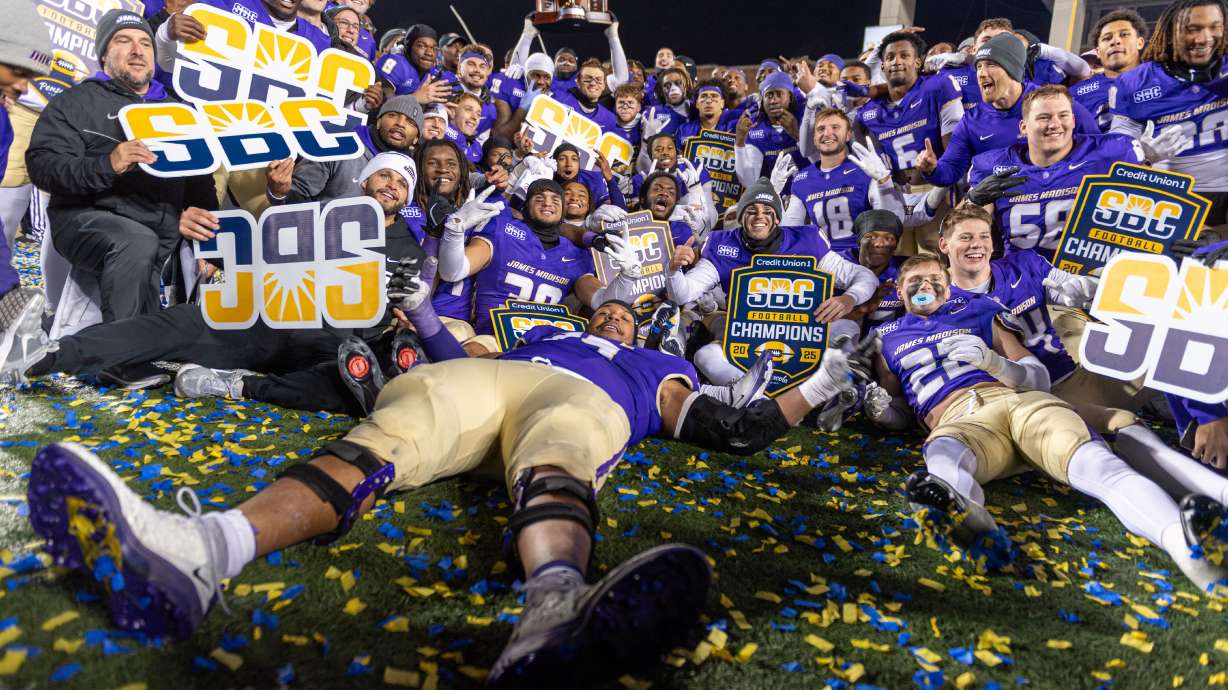 James Madison team celebrates after winning the Sun Belt championship NCAA college football game against Troy, Friday, Dec. 5, 2025, in Harrisonburg, Va.