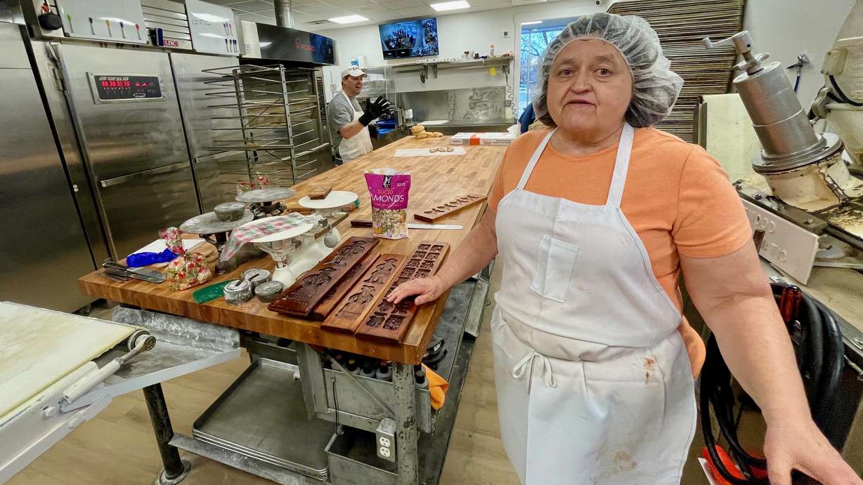 Valeen DeRyke of Topper Bakery in Ogden shows the wooden molds used to make speculaas cookies on Wednesday. The locale is offering its Christmastime treats for the first time in five years.