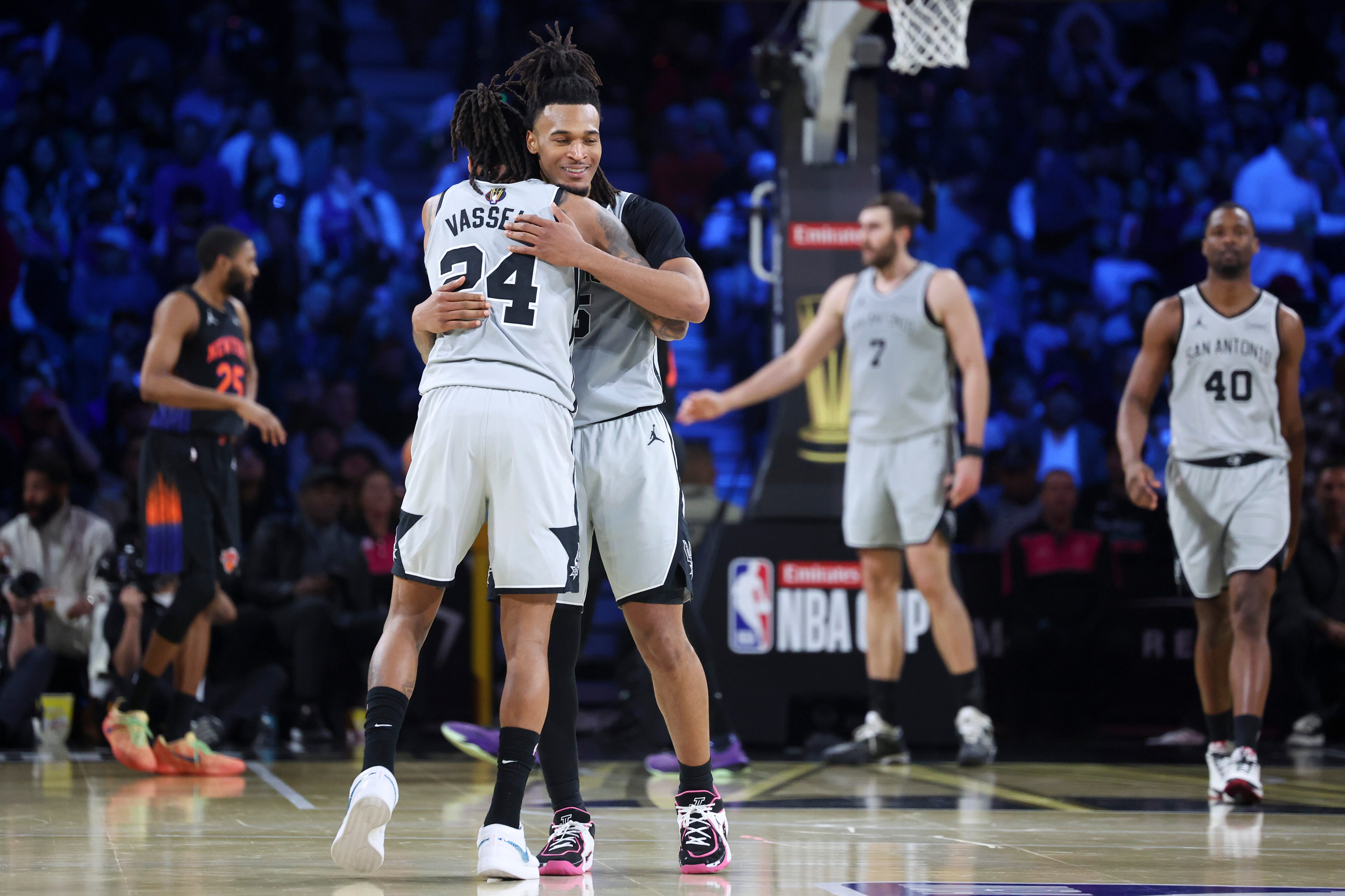 San Antonio Spurs guard Devin Vassell (24) and Stephon Castle react after a basket against the New York Knicks during the second half of the NBA Cup championship basketball game Tuesday, Dec. 16, 2025, in Las Vegas.