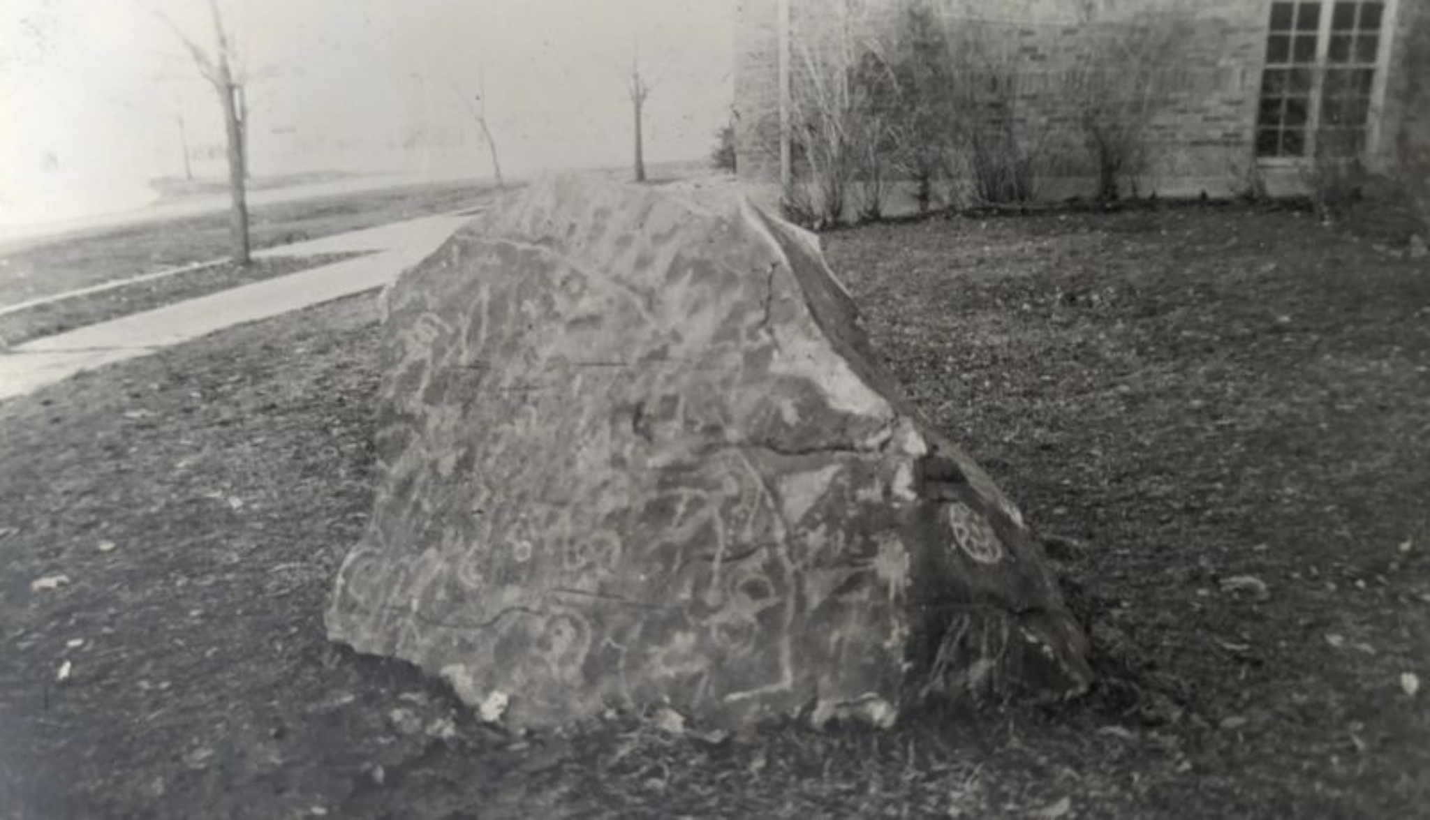 An undated photo of the petroglyph rock placed outside of the 1st Ward meetinghouse in Tremonton. The rock was taken from land near the Utah-Idaho border in the 1940s and brought back to Tremonton.