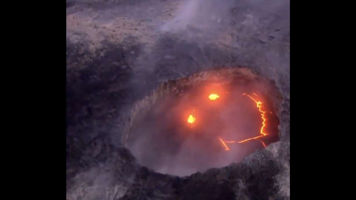 A shot of a "smile" from Kilauea volcano, taken by Mick Kalber, Sunday. The volcano has been violently erupting on and off recently, with a USGS camera being destroyed by the most recent episode.