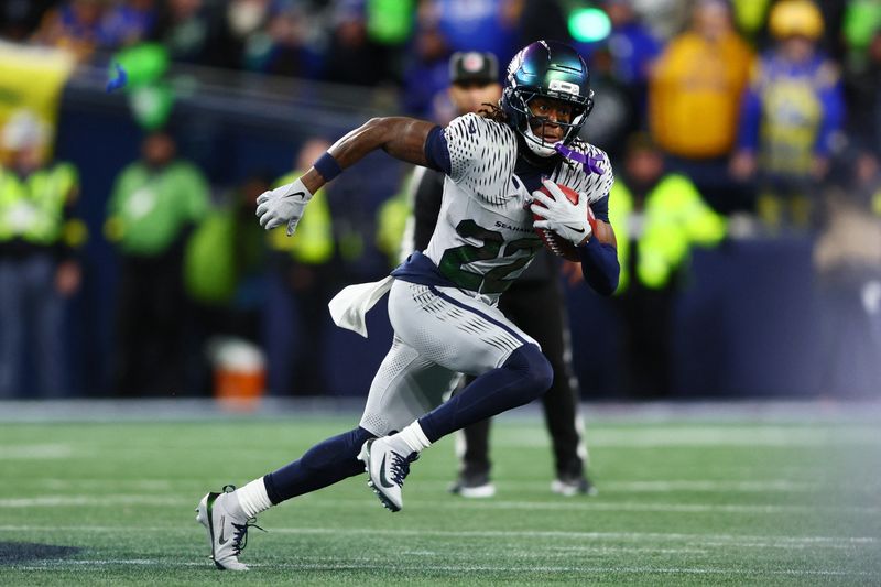 Dec 18, 2025; Seattle, Washington, USA; Seattle Seahawks wide receiver Rashid Shaheed (22) returns a punt for a touchdown against the Los Angeles Rams in the second half at Lumen Field.