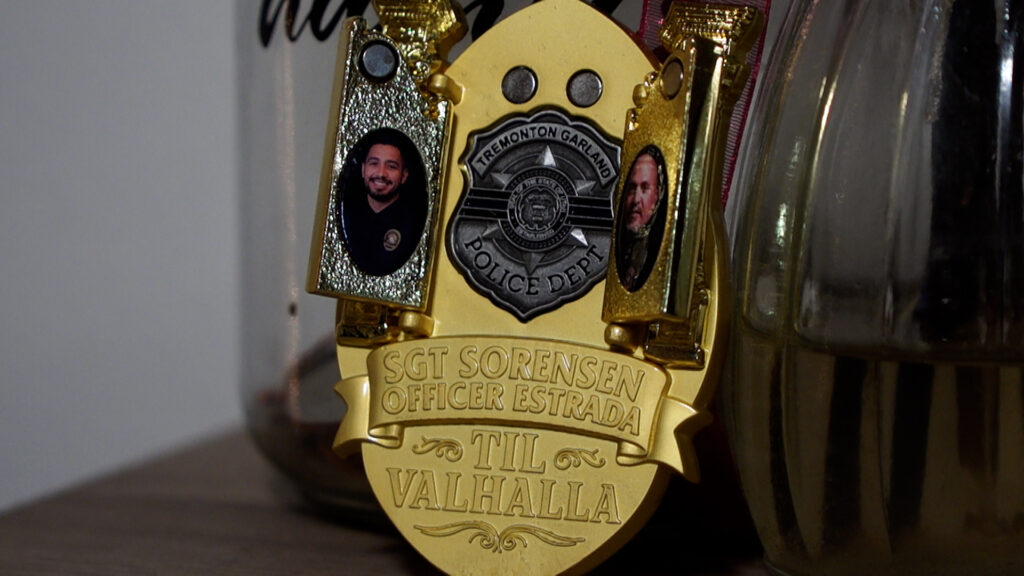 Badge with photos of the officers in the Johnston home.