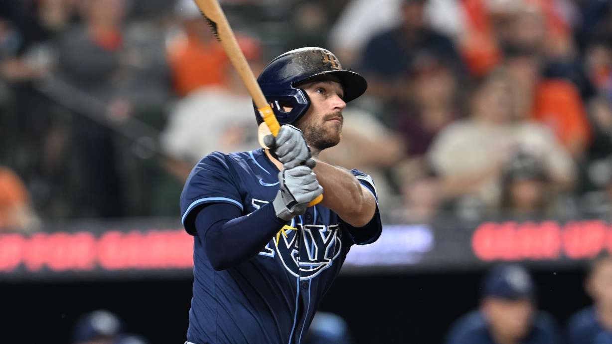 FILE - Tampa Bay Rays Brandon Lowe follows through on a solo home run against the Baltimore Orioles in the third inning of a baseball game, Wednesday, Sept. 24, 2025, in Baltimore.