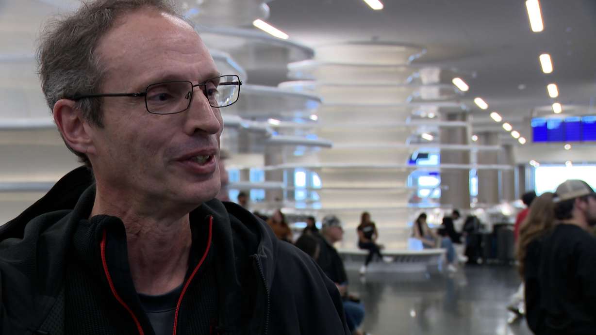 Shaun Sakib speaks with KSL at Salt Lake City International Airport, Friday. Sakib and his family are traveling to Germany for Christmas, as they do every year.