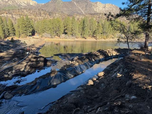 The channel being built to route water around the Pine Valley reservoir is shown. A wildfire and flooding led to the Pine Valley closure through the 2026 season, officials announced Friday.