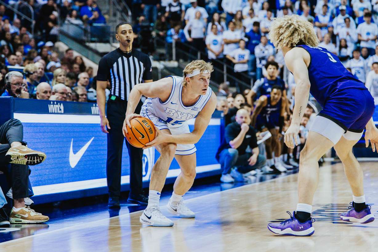BYU guard Richie Saunders sizes up a defender during an NCAA men's basketball game, Friday, Dec. 19, 2025 against Abilene Christian in the Marriott Center in Provo, Utah.