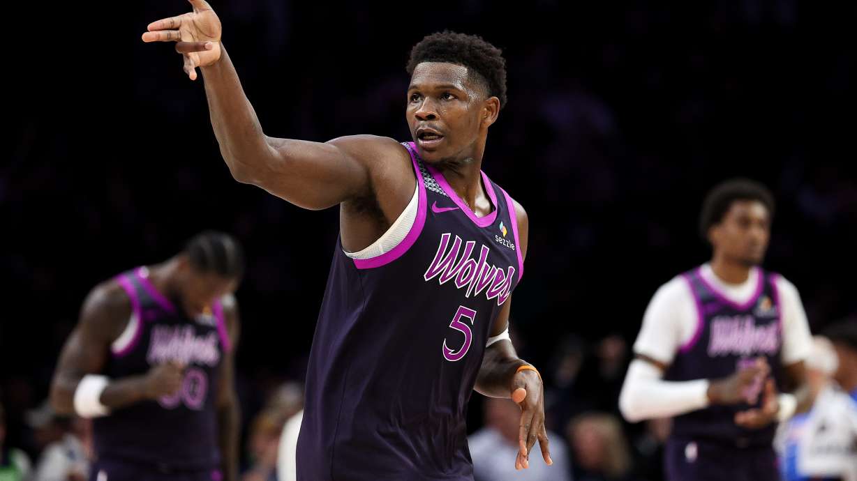 Minnesota Timberwolves guard Anthony Edwards celebrates his three-point basket against the Oklahoma City Thunder during the second half of an NBA basketball game Friday, Dec. 19, 2025, in Minneapolis.