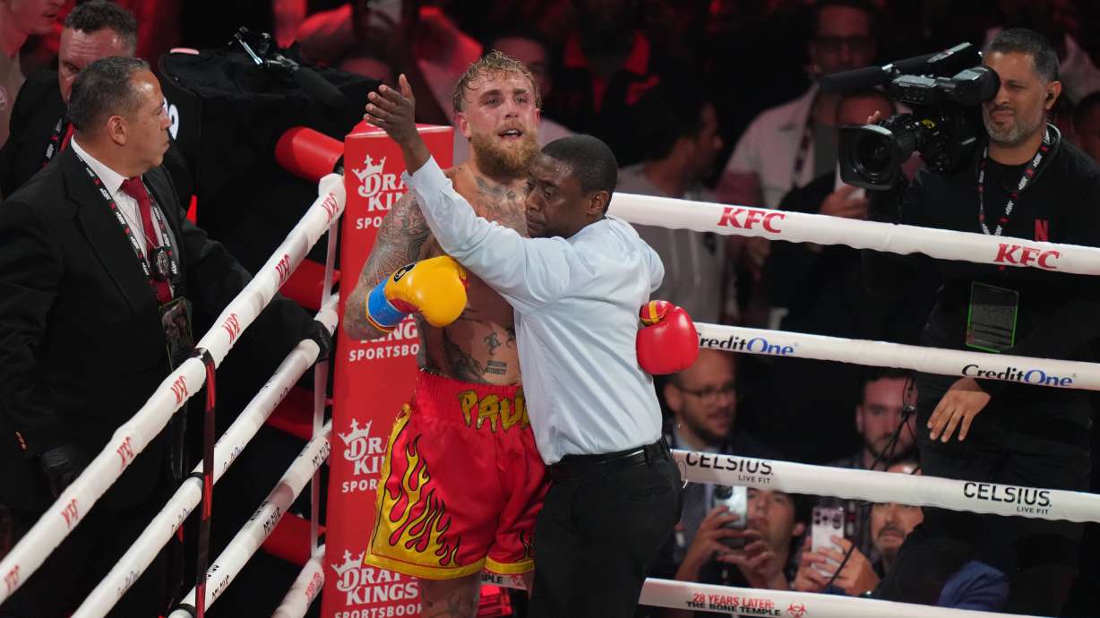 Jake Paul reacts during the heavyweight boxing match against Anthony Joshua, Friday, Dec. 19, 2025, in Miami, Fla.