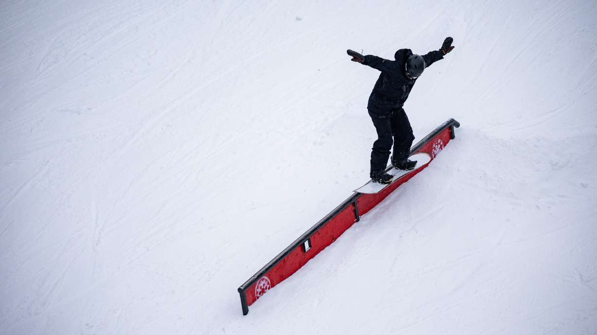 A snowboarder enjoys the terrain park during opening day at Brighton Resort in Brighton on Dec. 2.