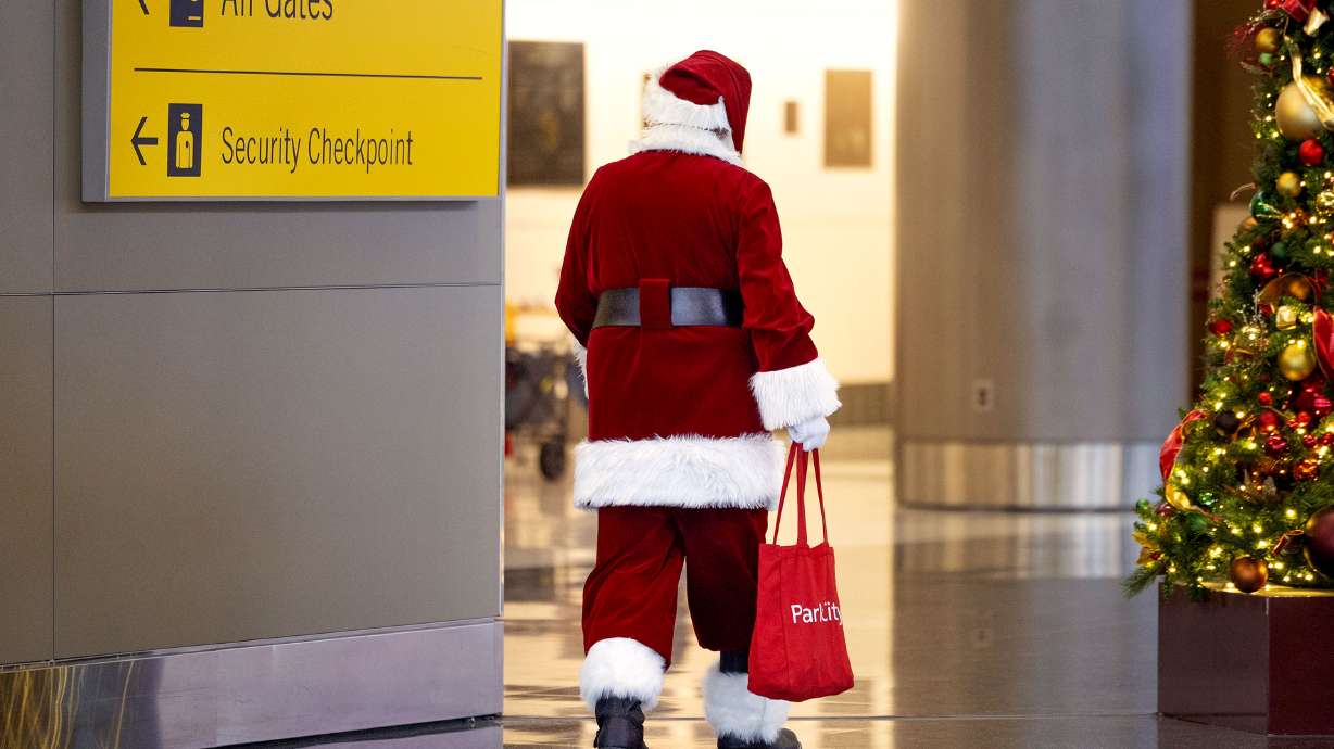 Santa Claus walks through Salt Lake City International Airport in 2023. A group of thieves dressed as Santa Claus and Christmas elves stole groceries this week at a Montreal store, citing inspiration from Robin Hood.