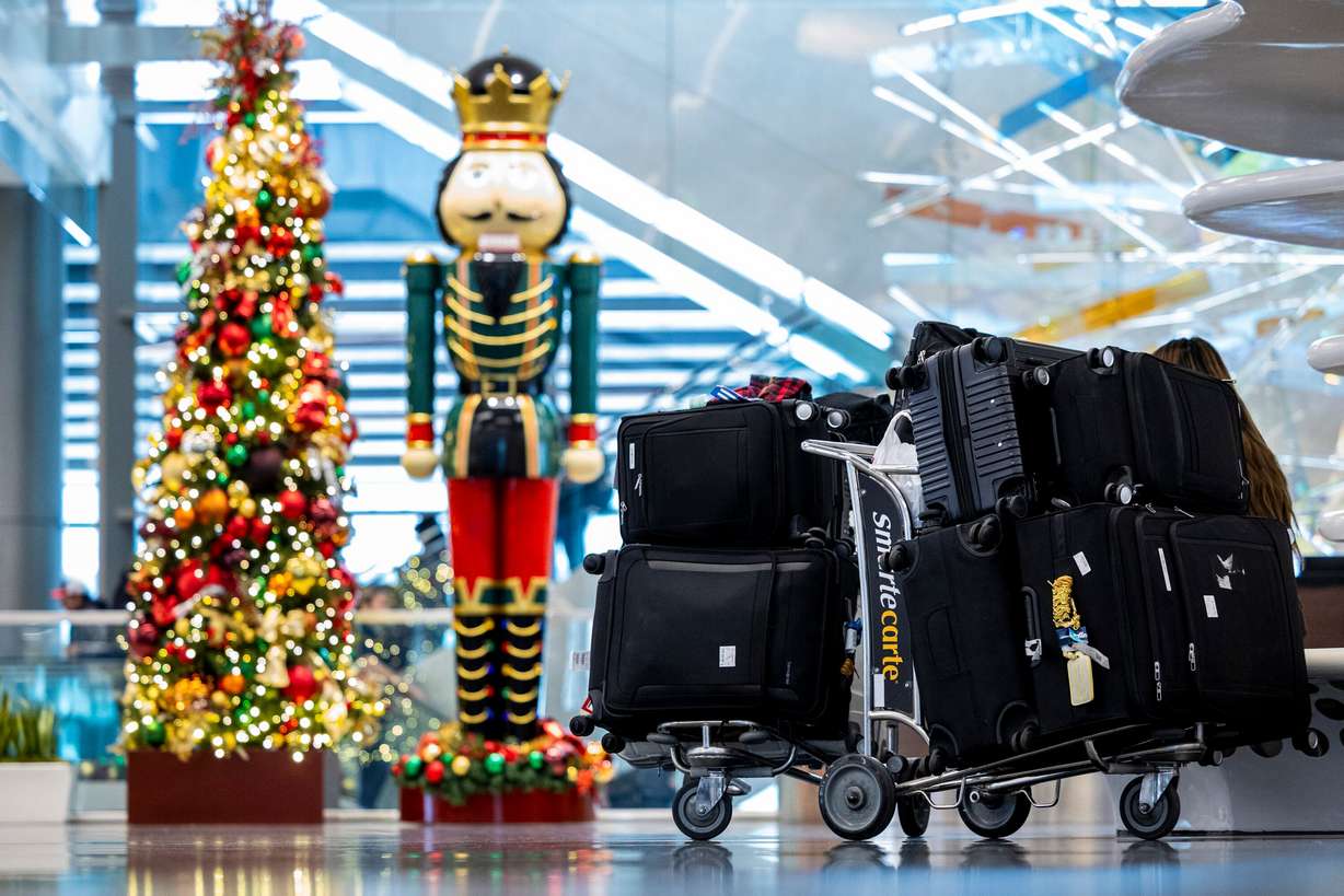 Bags are gathered by holiday decorations at the Salt Lake City International Airport on Nov. 12. The airport ranked No. 1 in on-time departures during the holidays in 2024.