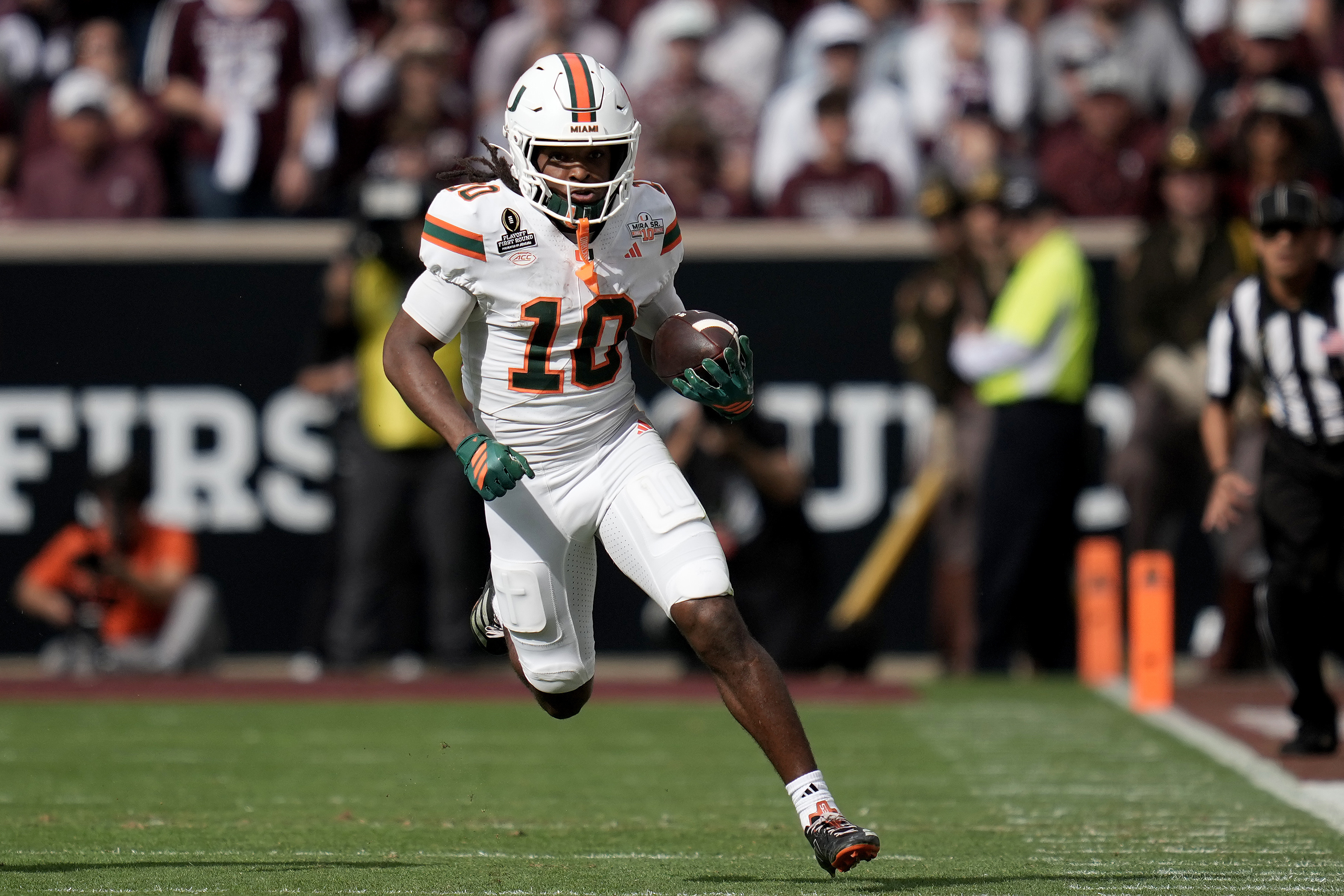 Miami wide receiver Malachi Toney (10) returns a punt against Texas A&M during the second quarter in the first round of the College Football Playoff Saturday, Dec. 20, 2025, in College Station, Texas.