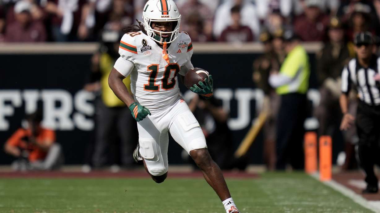 Miami wide receiver Malachi Toney (10) returns a punt against Texas A&M during the second quarter in the first round of the College Football Playoff Saturday, Dec. 20, 2025, in College Station, Texas.