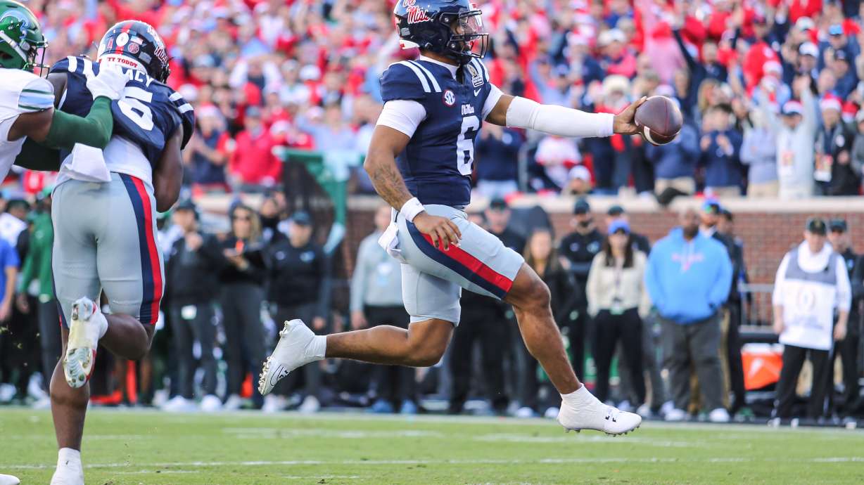 Mississippi quarterback Trinidad Chambliss (6) scores a touchdown against Tulane during the first round of the NCAA College Football Playoff, Saturday, Dec. 20, 2025, in Oxford, Miss.