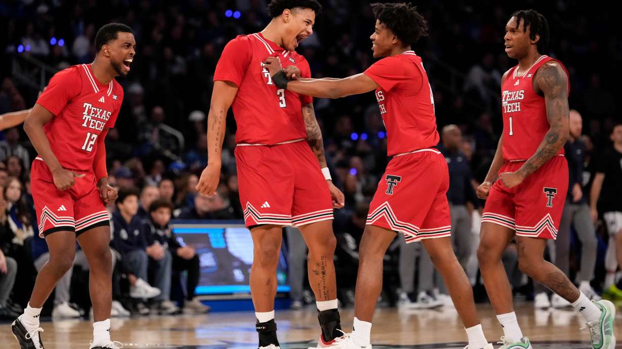 Texas Tech forward Lejuan Watts (3) celebrates with teammates after scoring during the first half of an NCAA college basketball game against Duke, Saturday, Dec. 20, 2025, in New York.