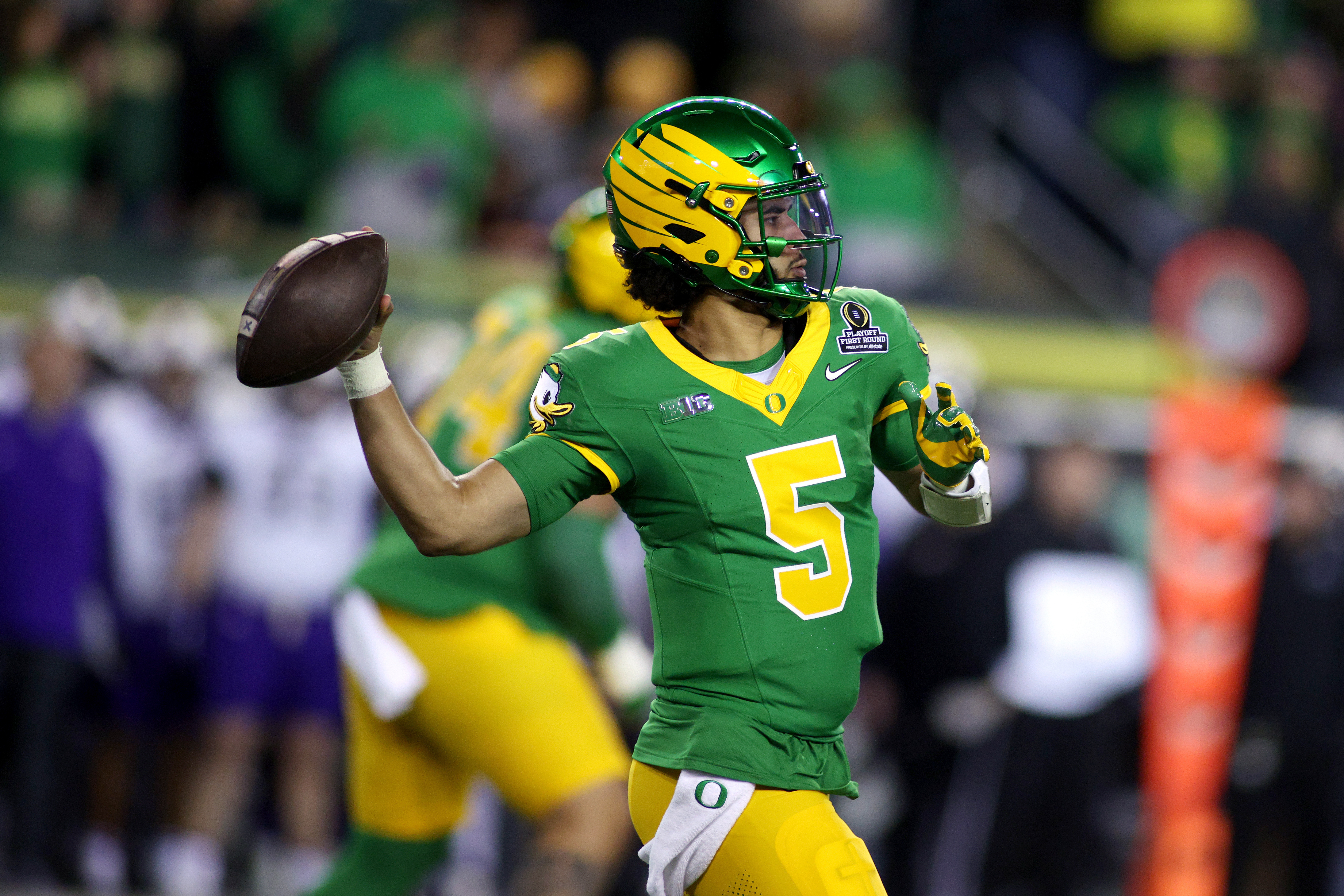 Oregon quarterback Dante Moore looks to pass the ball during the first half of the first round of the NCAA College Football Playoff against James Madison, Saturday, Dec. 20, 2025, in Eugene, Ore.