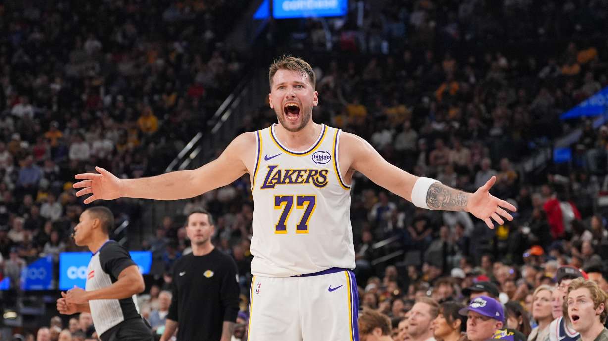 Los Angeles Lakers forward/guard Luka Doncic (77) reacts to a play during the first half of an NBA basketball game against the Los Angeles Clippers Saturday, Dec. 20, 2025, in Inglewood, Calif.