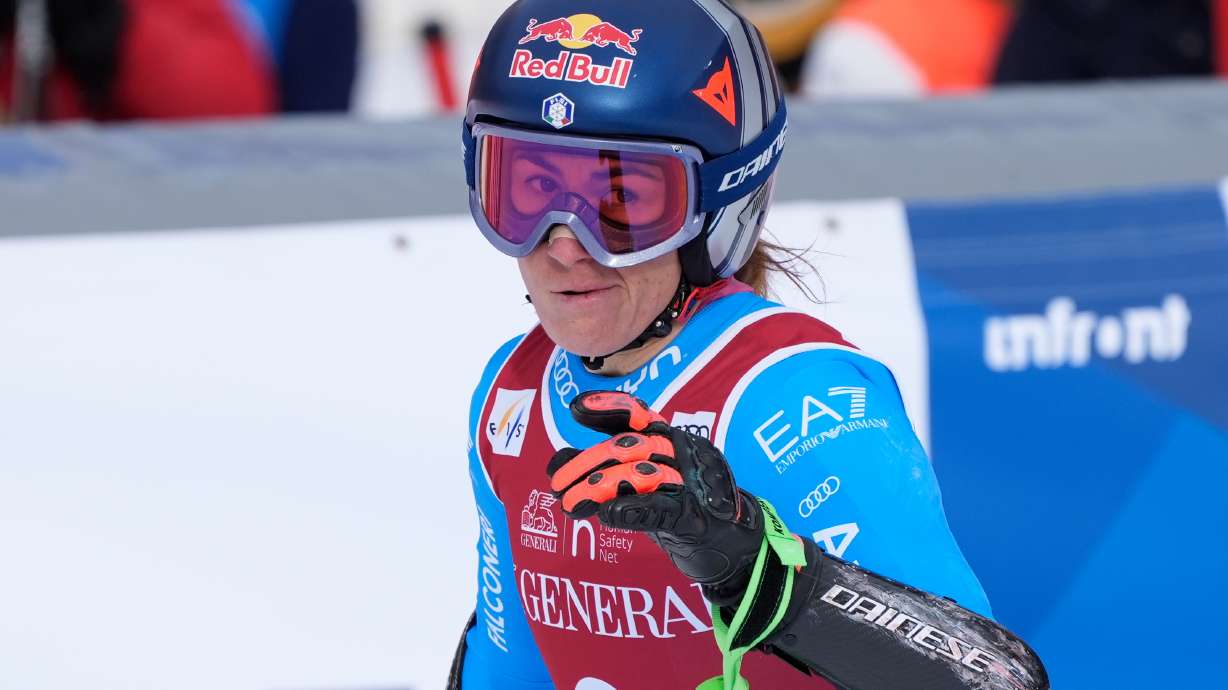 Italy's Sofia Goggia celebrates at the finish area of an alpine ski, women's World Cup super-G in Val d'Isere, France, Sunday, Dec. 21, 2025.