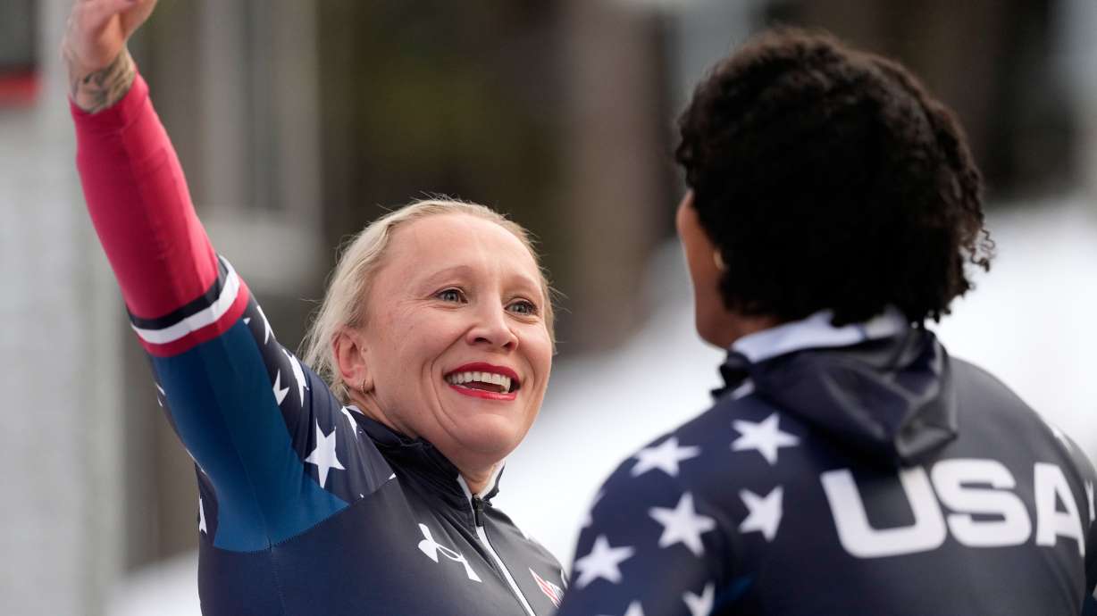 Kaillie Armbruster Humphries, left, and Jasmine Jones, of the United States, react after their second run of the 2-woman bobsleigh race at the Bobsleigh World Cup in Innsbruck, Austria, Sunday, Nov. 30, 2025.