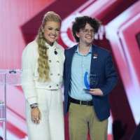 Utah Valley University student receives an award from Erika Kirk