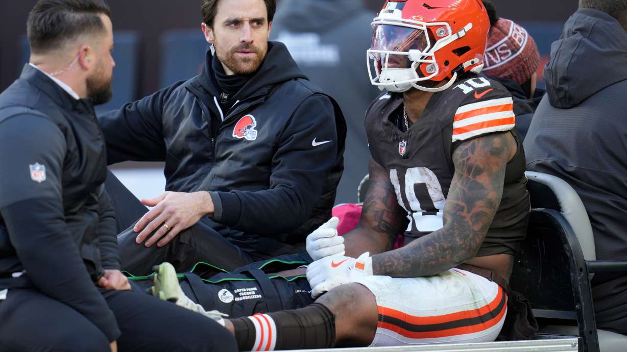 Cleveland Browns running back Quinshon Judkins (10) is carted off the field with an injury against the Buffalo Bills during the first half of an NFL football game in Cleveland, Sunday, Dec. 21, 2025.