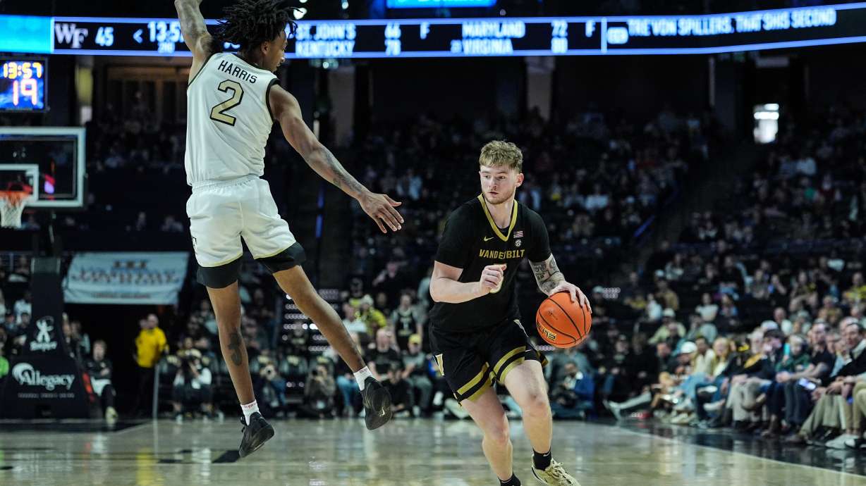 Vanderbilt forward Tyler Nickel drives past Wake Forest guard Juke Harris (2) during the first second of an NCAA college basketball game, Sunday, Dec. 21, 2025, in Winston-Salem, N.C.